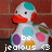 Pixelated cartoon duck with red beak, blue head patch, and multicolored spots on white body, standing against red brick background with text "jealous" at bottom.