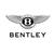 Pixelated grayscale icon featuring a winged circular emblem with two vertical bars inside, positioned above the word 'BENTLEY' in blocky capital letters.