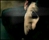A person's face in profile view with a dark background, featuring animated text 'af' that changes opacity and position across frames.