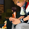 Pixelated anime-style character with blonde hair and red-white jacket sits in classroom, holding hands with smaller character in orange dress.