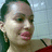 Pixelated close-up of a person's face with light skin tone, dark hair, and pink lips against a blurred background.