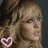 A pixelated image of a woman with blonde hair, featuring three heart symbols and red text reading "Lindsay" across the lower portion.