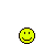 Yellow pixelated smiley face with black eyes and mouth above white rectangular shapes on gray background, transitioning to refrigerator-like forms with orange debris at base.