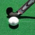 Pixelated icon shows a golf club striking a white ball on green grass background.