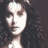 A four- shows a person with long dark hair against a dark background, with yellow text appearing in the top-right and bottom-right