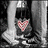 Pixelated grayscale image of a figure with dark hair holding a pink heart-shaped object, next to black background with pink text reading "i <3 Noah".