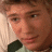 A pixelated image split into two sections: a person's face on the left and green text on a dark background on the right.