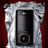 A static pixelated image shows a silver frame with ornate corners surrounding a dark rectangular panel against a deep red background.