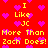 Red background with yellow text reading "I Like JC More Than Zach Does!" repeated, surrounded by pink heart shapes.
