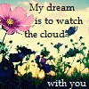 Pixelated image with pink flower, yellow flowers, green foliage, and text reading 'My dream is to watch the cloud with you' on a light background.