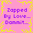 Pixelated pink background with yellow jagged border, purple text repeating 'Zapped By Love... Dammit...' in four quadrants.