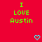 Red background with green text reading "I LOVE Austin" and two cyan pixelated hearts below the text.