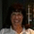 Pixelated image of a person with dark hair and a white shirt on the left, next to blue with text on the right and bottom