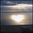 A static pixelated image shows a bright white heart shape centered against a gradient background of light brown and gray tones.