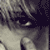 A black-and-white animated sequence showing a person's face with shifting expressions including closed eyes, open mouth, and visible tears.
