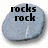 Pixelated gray rock icon with black text 'rocks' above 'rock' in bold, blocky font on a white background.