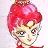 Pixelated character with bright red hair styled in a high bun, wearing a red outfit with green accents, against a light background.