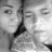 Black-and-white photo of two people in close proximity on left; green pixelated text on black background on right.