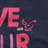 Pixelated red text on dark backgrounds with partial visible letters and a statement about American Eagle.