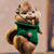 Animated cartoon chipmunk in green sweater with white accents, smiling and shifting pose across frames.