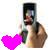 A pixelated static image shows a person holding a bright pink heart-shaped object against a light background.