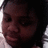 A person with dark hair and light skin appears in a cropped close-up, partially visible against white and gray background sections.