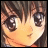 Anime-style character face with brown hair and large eyes, next to pixelated text on black background.