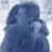 A low-resolution static icon depicting a blue-toned figure with indistinct facial features against a light background, rendered in pixelated style with no visible text or distinct props.