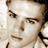 Static 48x48 pixel icon showing a close-up of a person's face with brown hair and neutral expression, rendered in sepia-toned pixels on white background.