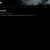 A static image with a black background and faint horizontal gray bars near the top.