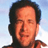 Pixelated static image of a person with dark hair and light skin against a blue sky background, rendered in low-resolution 256x256 pixels.
