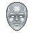 Pixelated silver face with smooth rounded contours, white rectangular eyes, and a neutral expression on a gray background.