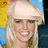 Pixelated image of a smiling blonde woman with a light-colored headband on the left, next to red background with white text and symbols.