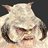 Pixelated static image of a light-colored creature with large curved horns, dark eyes, and a neutral expression against a solid dark background.