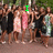 Group of people in outdoor setting with green text overlay changing across frames.
