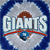 Static pixelated icon featuring the word "GIANTS" in large white letters with a red underline, set against a blue and gray background with cloud-like shapes.