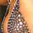 A four- shows a person with light brown skin wearing a silver sequined headpiece, smiling broadly in the top-left and bottom-left while the top-right focuses on their mouth