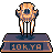 Pixelated character with orange-brown body, dark blue eye, and white legs stands on a dark blue platform with 'TOKYO' text.