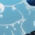 A static pixelated image with light blue background and white abstract branching lines forming a network-like pattern.