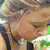 Six distinct pixelated portraits of individuals in various poses and backgrounds, arranged in a