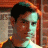 A 48x48 pixel buddy icon split into two sections: a left-side portrait of a person with dark hair and light skin against a brick wall background, and a right-side green text logo reading "Original Icons .com" in stylized font.