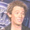 25 identical head-and-shoulders portraits showing a person with light brown hair against a blue background with repeating white text