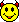 Two yellow pixelated smiley faces with black outlines, red and dark red devil horns, green cheek marks, and a mouth showing red lips over green teeth against gray background.