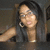 A woman with long dark hair and glasses appears in a of four , with the rightmost partially obscured