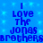 Blue background with pixelated text reading "I Love The Jonas Brothers" repeated twice in a pattern