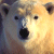 Pixelated close-up of a polar bear's face with dark eyes and nose, rendered in warm yellow and gray tones against a blurred background.
