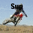 A pixelated image of a person riding a bicycle on a dirt path with text above them changing across frames.
