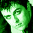 Pixelated green-toned icon of a person's face with closed eyes and a neutral expression, set against dark background.