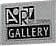 Two side-by-side pixelated images of a 'GALLERY' icon with a stylized 'R' symbol, differing in background color and symbol details.