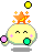 A yellow rounded character with closed eyes and pink blush marks holds a green circle in its left hand while an orange star with yellow sparkles sits atop its head, surrounded by floating colored circles.